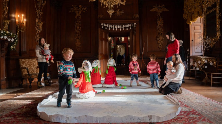 Visitors admire the majestic animal decorations created by artist Sophie Tyrrell in the Saloon at Lyme, Cheshire